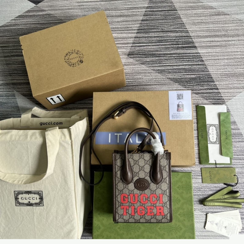 G*u*i top handle bags